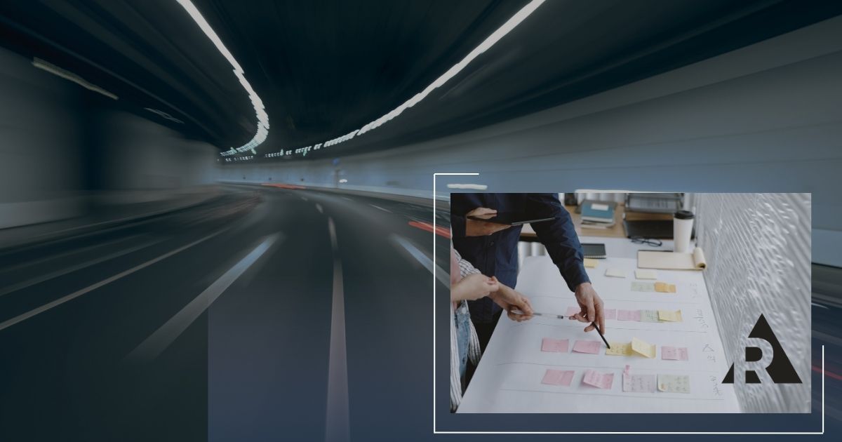 Blurred motion view of a vehicle traveling through a tunnel, positioned beside a business meeting where a team collaborates around a conference table