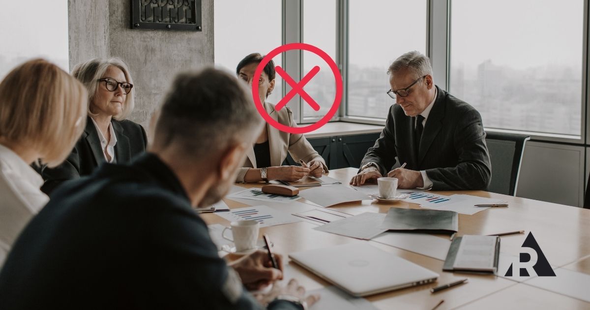 Business meeting with red X warning symbol