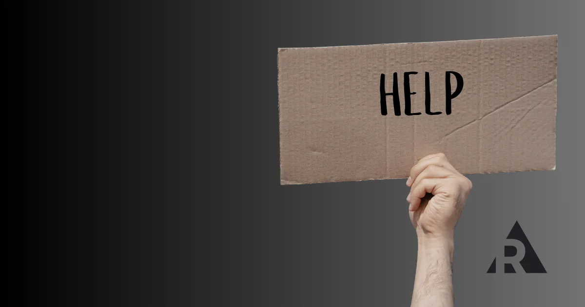 Someone holding sign with the word help on it