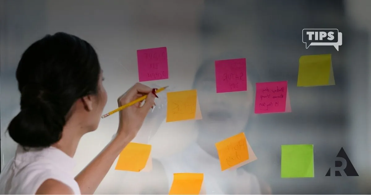Women organizing backlog with sticky notes
