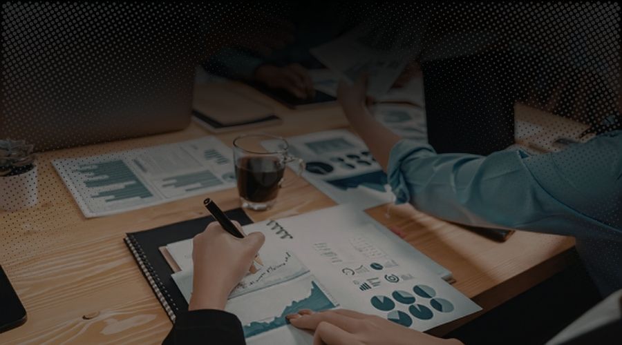 Suggested alt text: Team reviewing business data to perform a gap analysis